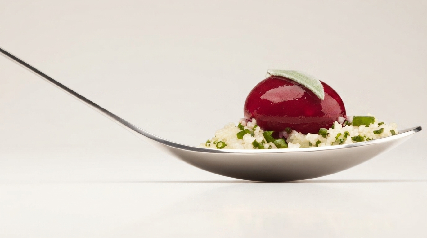 A chef using liquid nitrogen to freeze a dessert in a modern kitchen, illustrating the scientific principles of molecular gastronomy.